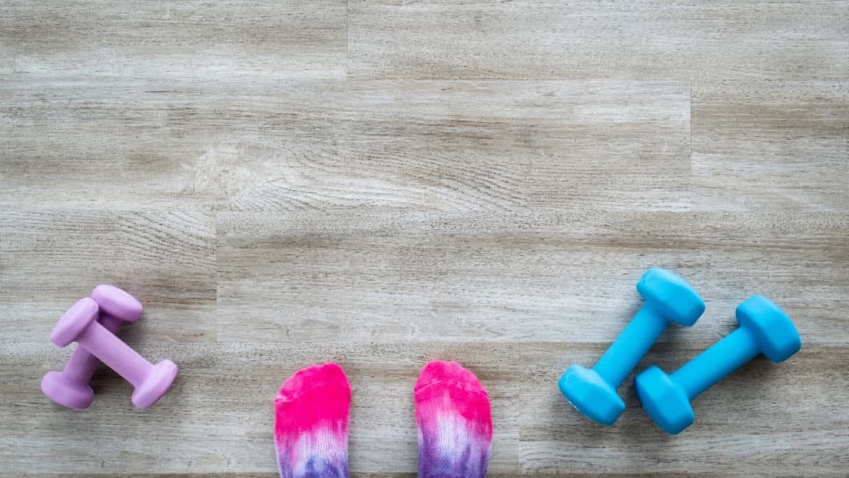 An aerobic step and resistance band on a gym floor