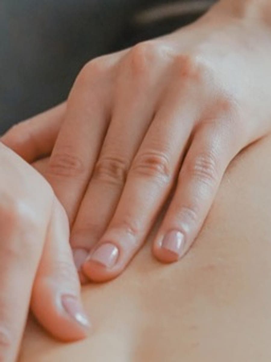 Hands-on physiotherapy treatment of a patient’s back